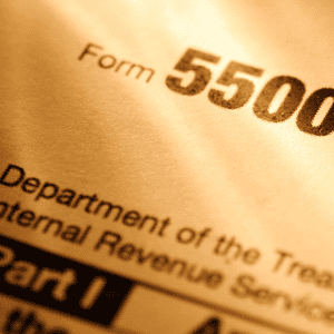 Close-up of IRS Form 5500 header showing Department of Treasury label, essential document for employee benefit carriers' data analysis.
