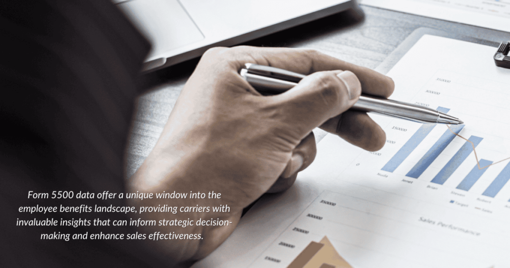 Business professional analyzing Form 5500 data trends with declining graph charts, highlighting strategic decision-making for employee benefit carriers.
